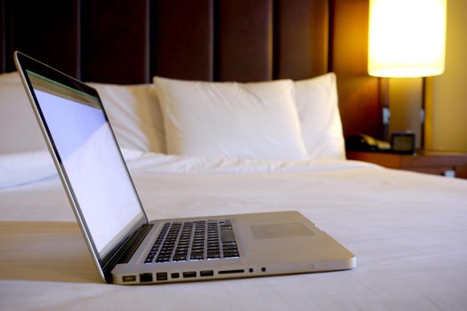 Luxury hotel bedroom with white linen