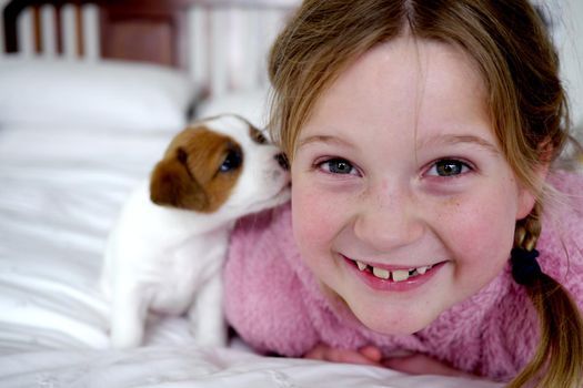 Little girl and her cute puppy