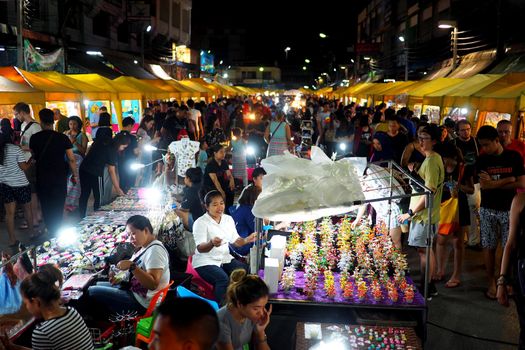 Tourists in a night market in Thailand