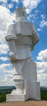 Svyatogorsk, Ukraine 07.16.2020.  Monument to Artem on the mountain above the Svyatogorsk or Sviatohirsk lavra on a sunny summer morning