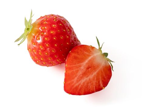 Strawberry whole and half isolated on white. Ripe fresh organic strawberry from own garden, isolated on white background with clipping path.