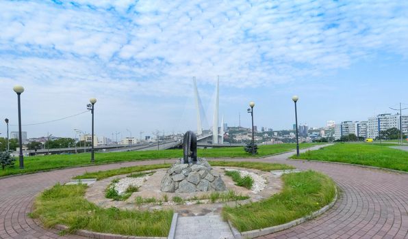 Vladivostok, Primorsky Krai-September 3, 2019: Panorama of the urban landscape overlooking the Golden bridge and the tiger sculpture