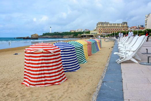 BIARRITZ, FRANCE - CIRCA SEPTEMBER 2013: Colourful tents on Biarritz Grande Plage (great beach)