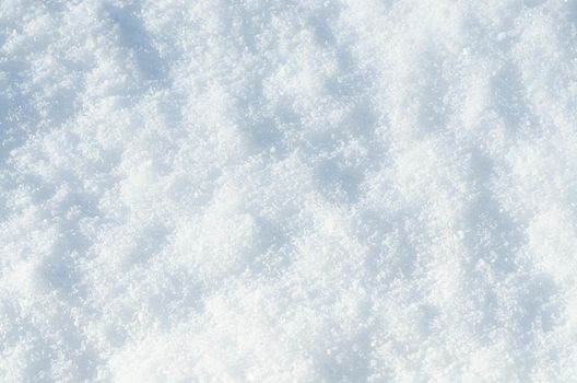 Top view of the natural pure snow in winter with copy space. Beautiful abstract snowy white texture for design. Winter landscape. Christmas background. Stock photo