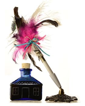 An isolated over white background image of a glass jar of ink and a feather pen.