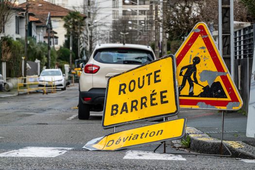 Road closed, diversion and road work signs in French town