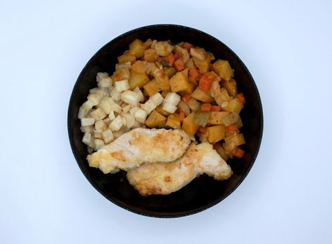 Dish fried chicken fillet fried in celery stewed vegetable stew.