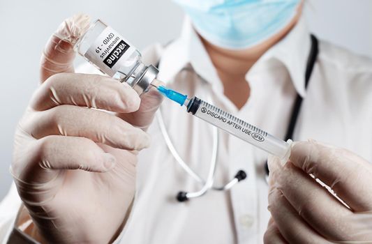 Doctor or nurse is injecting Coronavirus Covid-19 Vaccine preparing for vaccination concept