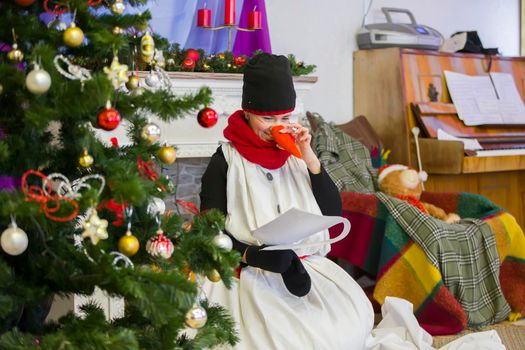 Belarus, the city of Gomel December 27, 2018.. Morning party in kindergarten. Teacher in a snowman costume at a Christmas children's holiday.