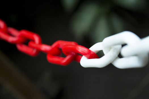 Plastic chain in white and red. Copy space
