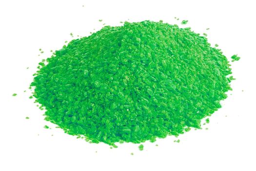 Pile of dry green chemical granules - close-up isolated on white background. Edge-to edge sharp.