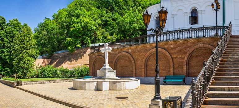 Svyatogorsk, Ukraine 07.16.2020.  Memorial cross at the entrance to the Assumption Cathedral in the Svyatogorsk Lavra on a sunny summer day