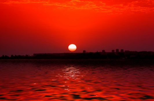 Sunset over the city against the sea. Sukhumi, Abkhazia