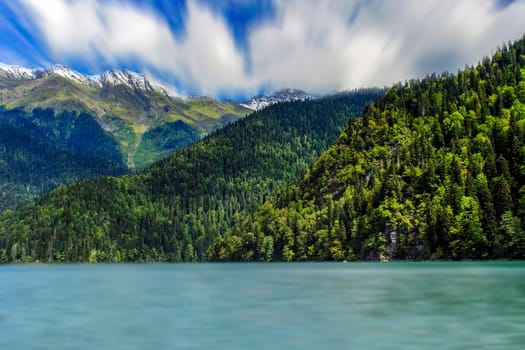 Ritsa, Abkhazia. The magnificent mountain scenery on the background of emerald lake Ritsa in Abkhazia