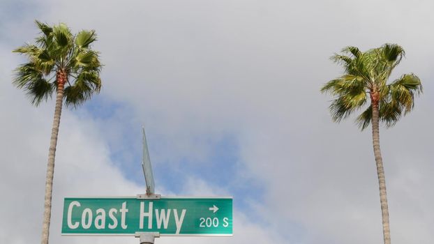 Pacific Coast Highway, historic route 101 road sign, tourist destination in California USA. Lettering on intersection signpost. Symbol of summertime travel along the ocean. All-American scenic hwy.
