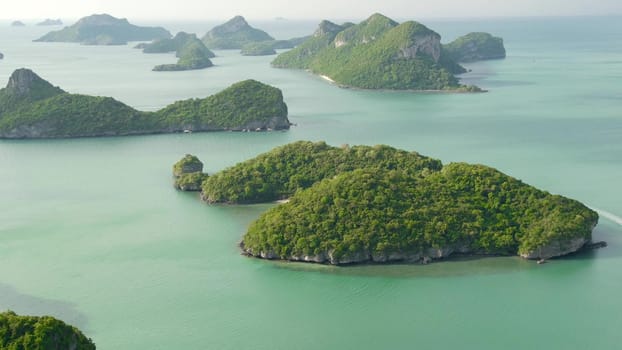 Bird eye panoramic aerial top view of Islands in ocean at Ang Thong National Marine Park near touristic Samui paradise tropical resort. Archipelago in the Gulf of Thailand. Idyllic natural background.