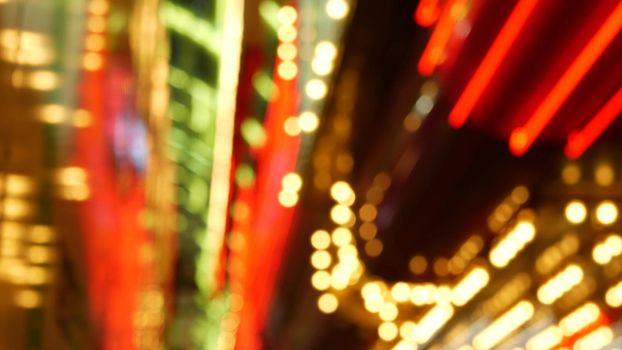 Defocused old fasioned electric lamps glowing at night. Abstract close up of blurred retro casino decoration shimmering, Las Vegas USA. Illuminated vintage style bulbs glittering on Freemont street.