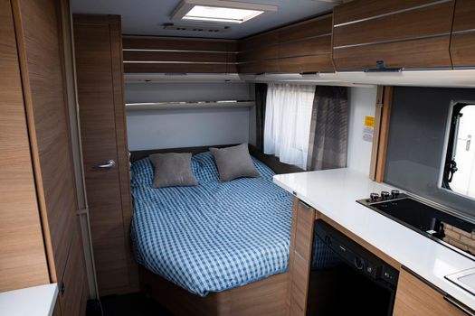 kitchen and bed of new expensive caravan mobile home