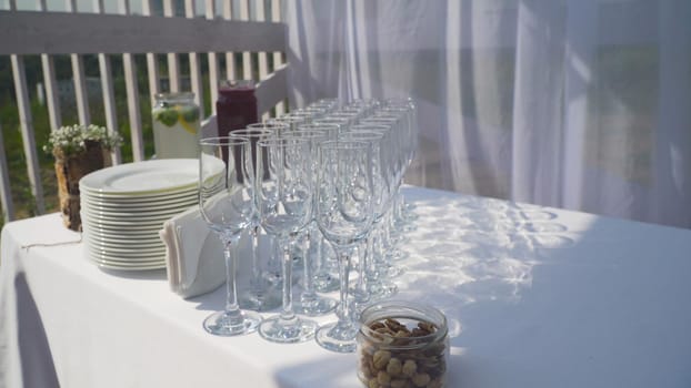 Banquet decorated table, with cutlery. Serving of a festive table, plate, napkin, knife, fork. Table setting decoration. Romantic Dinner or other events.