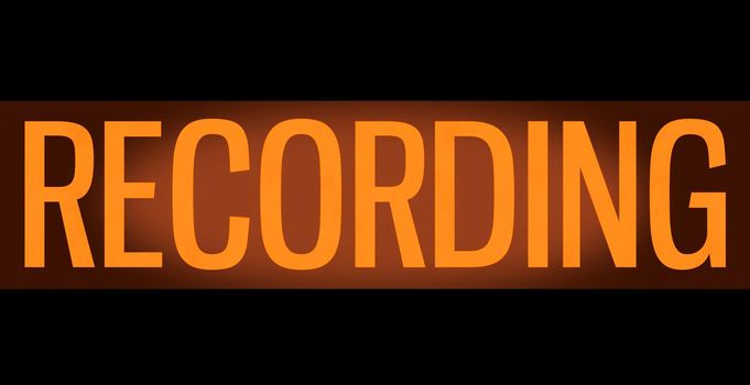 A Retro, Orange Glowing Recording Sign In A Music Studio Or Radio Or TV Station