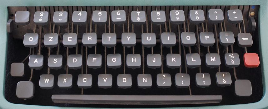 vintage qzerty typewriter keyboard with dusty keys