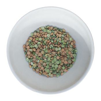 lentils and green peas in a bowl isolated over white background