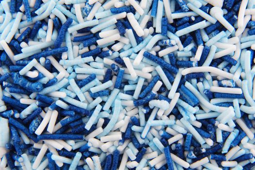 White and blue hundreds and thousands sprinkles sugar beads for decorating cakes and desserts