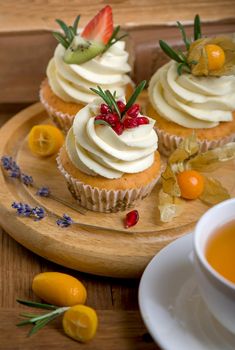 muffins with traditional fall spices. With tea cup. White marble table, copy space