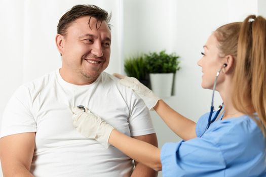 female doctor examining patient hospital health care. High quality photo