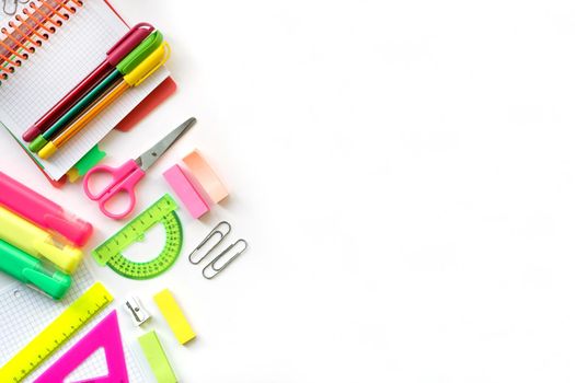 School and Office drawing supplies isolated on white background. Free space for text. Back to school. Top view border of colour pens, markers, rulers and note