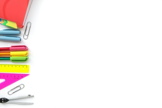 School and Office drawing supplies isolated on white background. Free space for text. Back to school. Top view border of colour pens, rulers and note