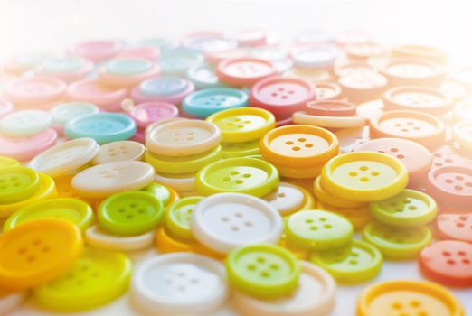 Many Colorful Sewing buttons. Bright background