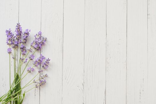 Composition of lavender on wooden background. Fresh summer flowers. Free space