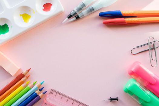 School drawing supplies on pink background. Free space for text. Back to school. Top view