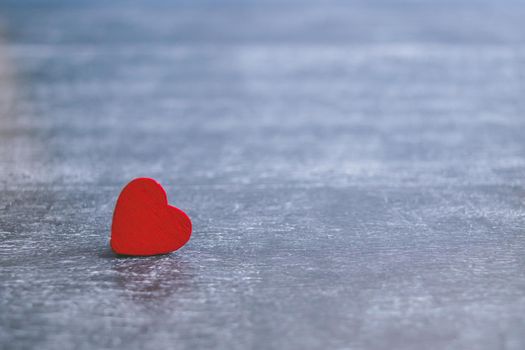 Valentines day card with red heart on dark wooden background, love message. Love concept. Romantic. Copyspace