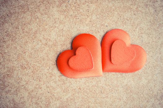 Two Red hearts on the wooden desk background. Copyspace