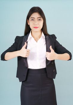 Asian business women in suit and thump up hand sign