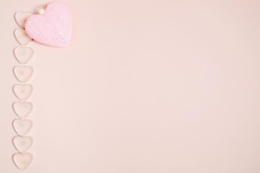 Valentine's Day, composition of hearts on a pink background. View from above. Space for text, flat lay