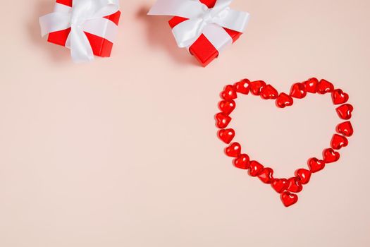 Valentine's Day, composition of hearts on a pink background. View from above. Space for text, flat lay