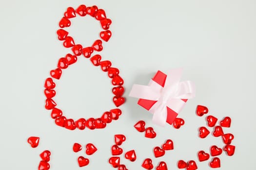 March 8, composition of hearts on a blue background. View from above. Space for text, flat lay