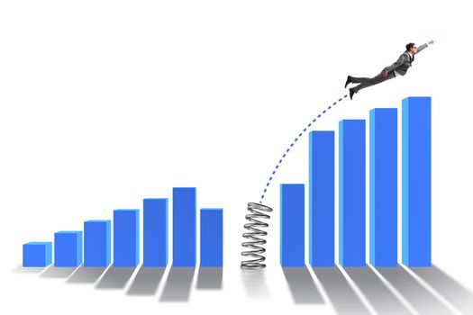 Business people jumping over bar charts