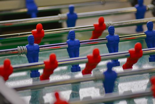 Table football, also known as table soccer or foosball in is a table-top game close up view