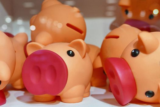Toy piggy banks closeup view