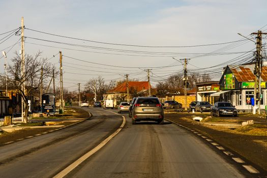 Road view through car windshield, cars on road in traffic in Bucharest, Romania, 2021