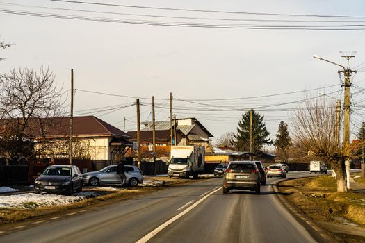 Road view through car windshield, cars on road in traffic in Bucharest, Romania, 2021