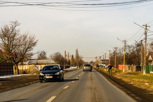 Road view through car windshield, cars on road in traffic in Bucharest, Romania, 2021