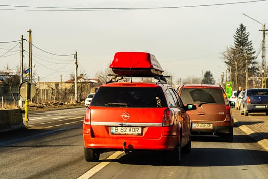 Road view through car windshield, cars on road in traffic in Bucharest, Romania, 2021