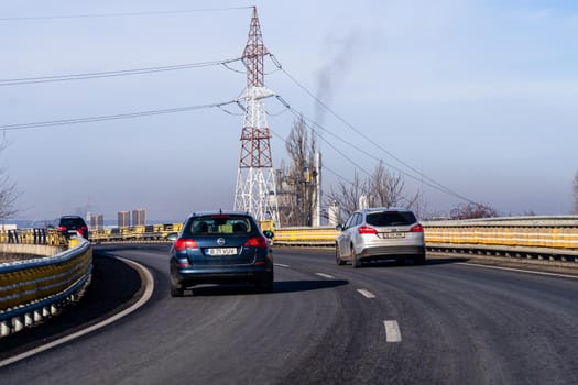 Road view through car windshield, cars on road in traffic in Bucharest, Romania, 2021