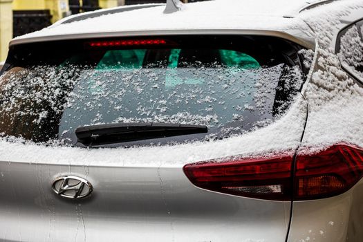 Rear car window covered with snow. Snow on car back wiper in Bucharest, Romania, 2021