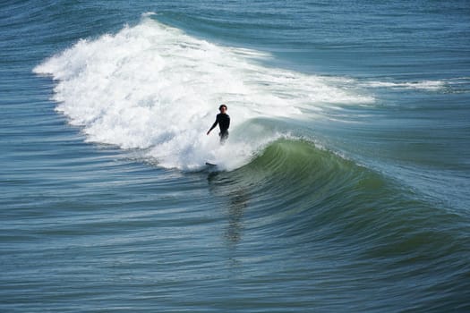 Male surfers enjoying the big wave in Oceanside in North San Diego, California, USA. Travel destination in the South West Coast famous for surfer. January 2n, 2021